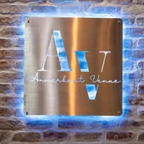 Illuminated Annerkant Venue sign on a brick wall
